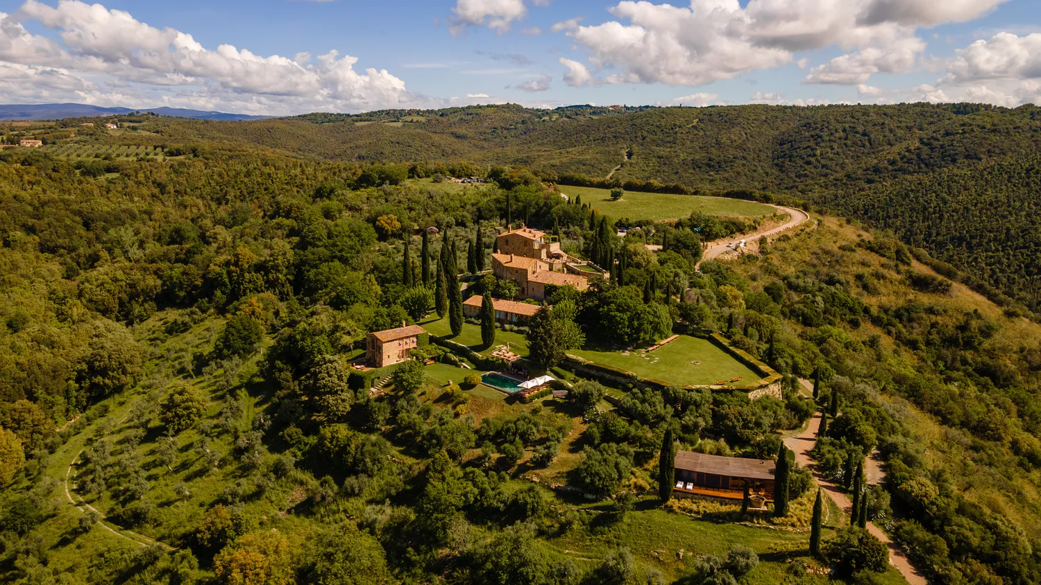 Aerial view of Castello di Vicarello, a stunning Italian castle wedding venue nestled in the Tuscan countryside.