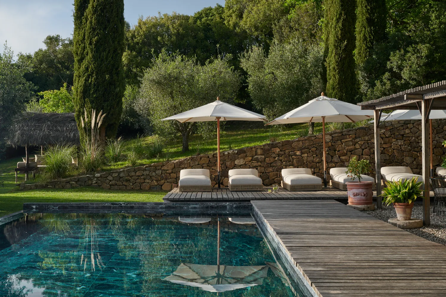 Luxury pool and lounge area at Castello Di Vicarello, a stunning castle wedding venue.