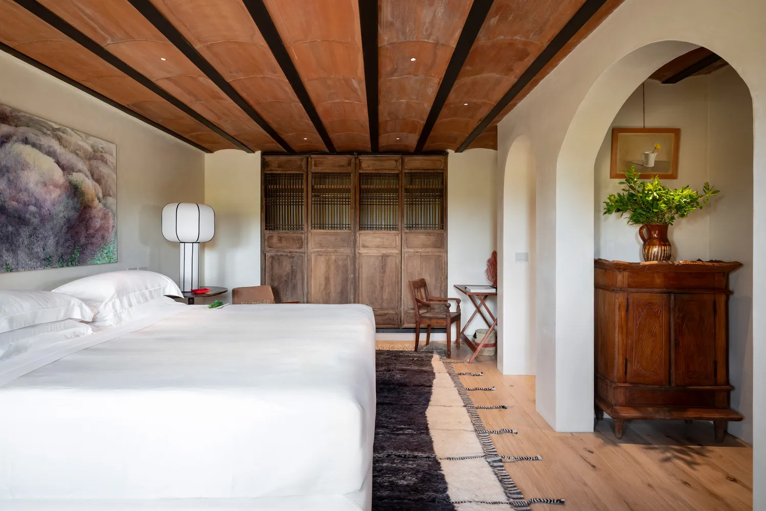 Luxurious bedroom at Castello Di Vicarello, a stunning castle wedding venue.