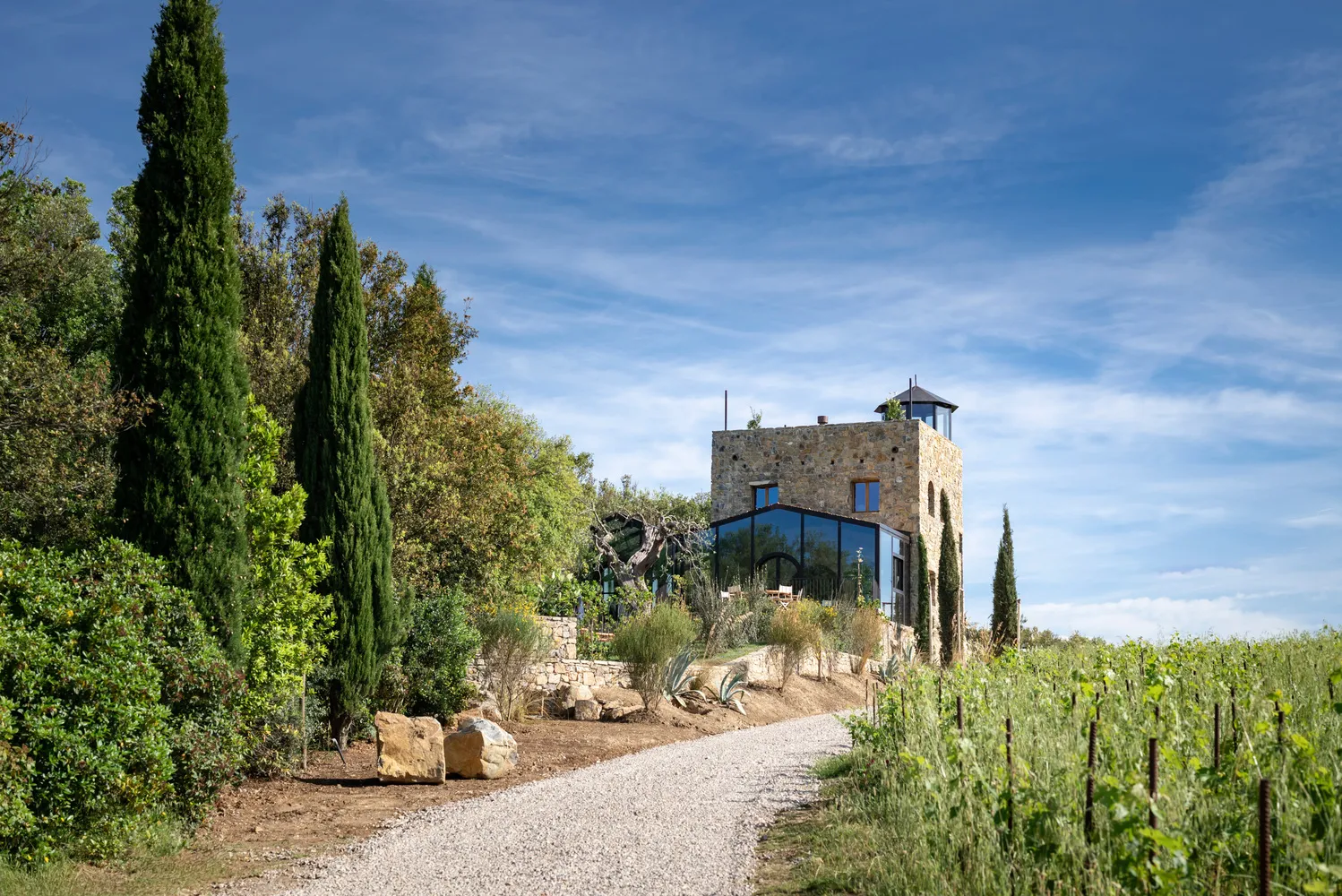 Gravel path leading to Castello Di Vicarello, a stunning castle wedding venue in Tuscany.