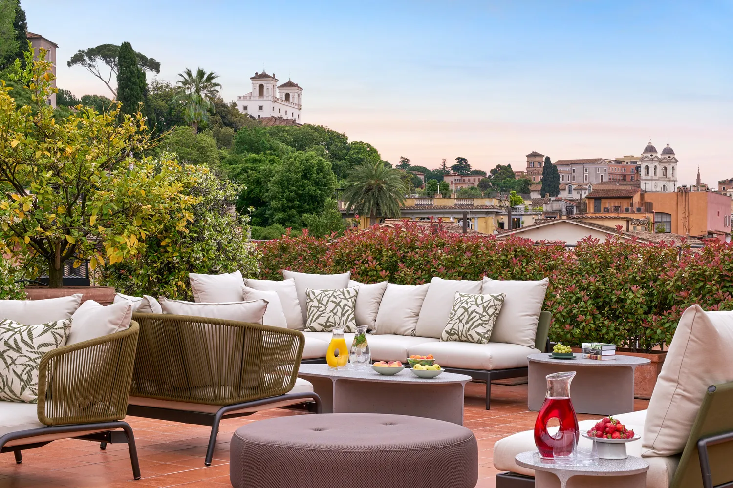 Hotel De Russie rooftop terrace with city views, perfect for a romantic Rome wedding.