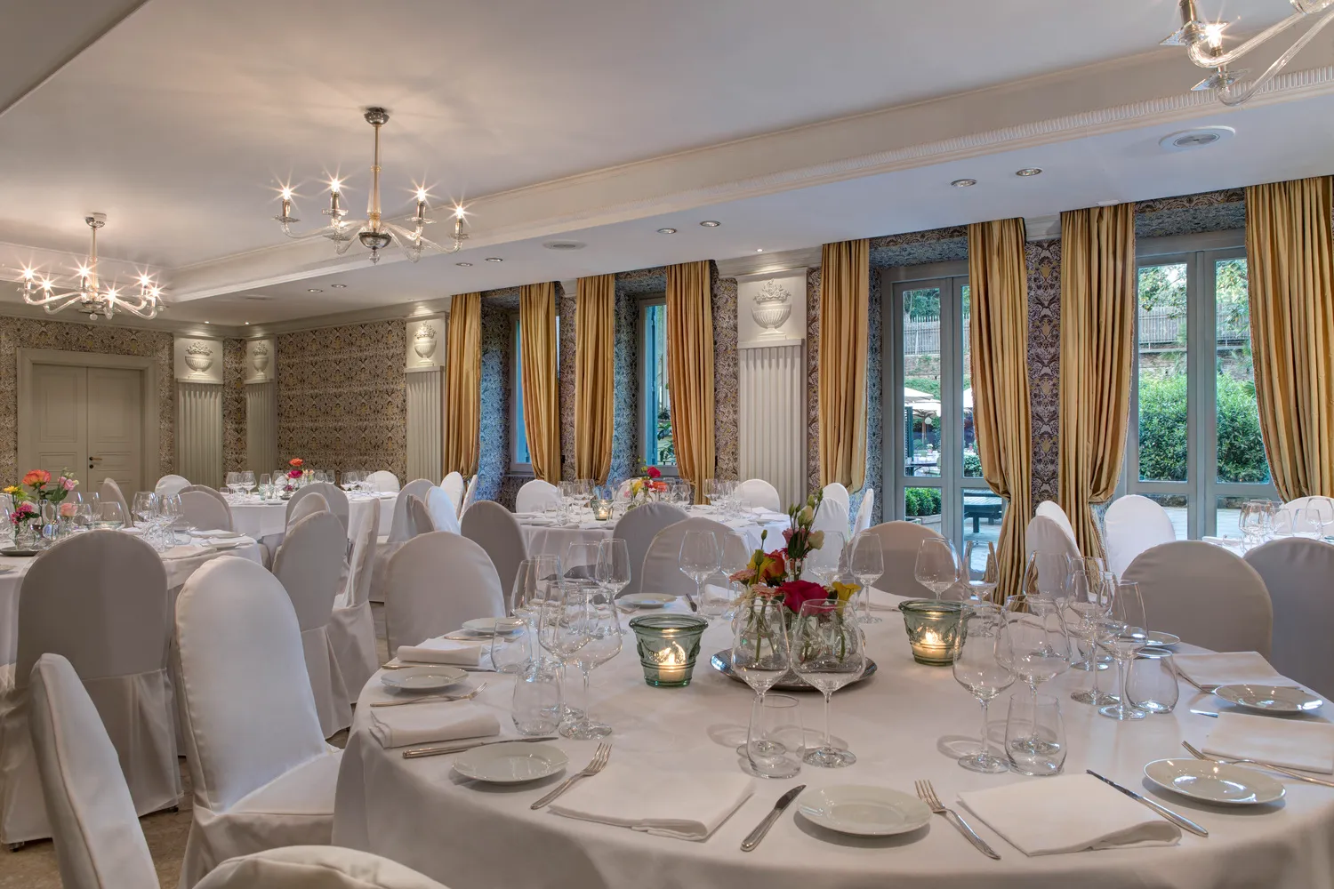 Elegantly set tables for a destination wedding in Rome at Hotel de Russie, a Rocco Forte Hotel.