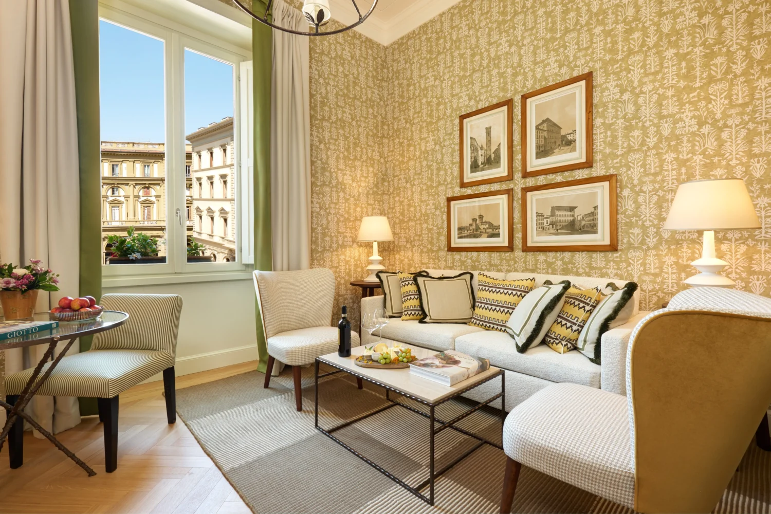 Luxurious living room in a Florence hotel, featuring a comfortable sofa and city views. Ideal for a romantic honeymoon.