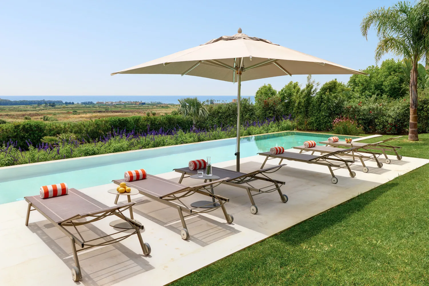 Luxury pool and lounge chairs at Verdura Resort in Sicily, ideal for a destination wedding.