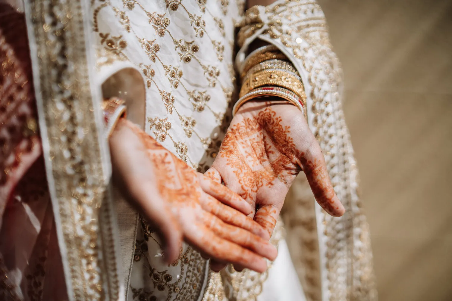 Bride's henna-decorated hands at a Sicily destination wedding.