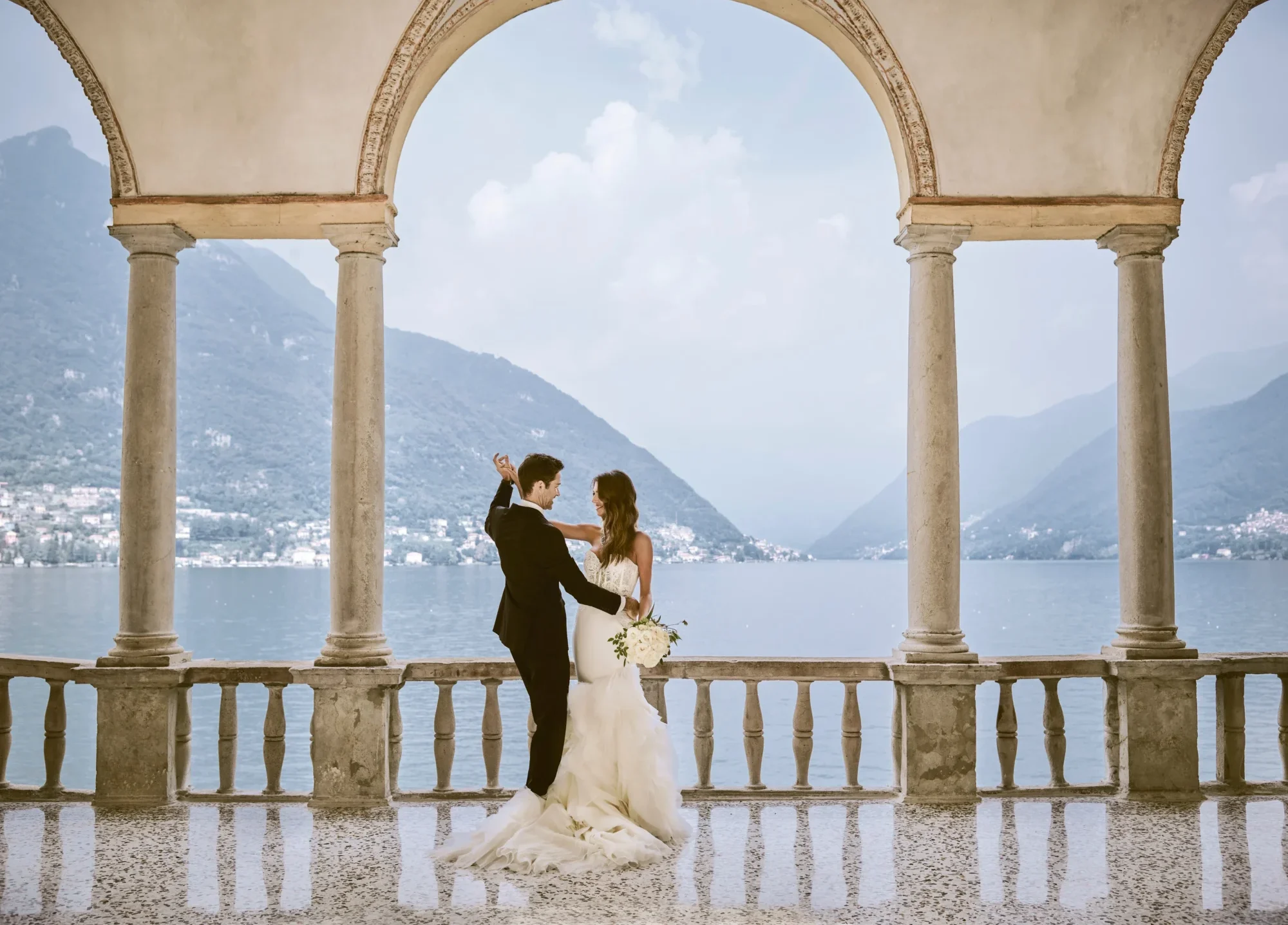 Bride and groom dancing at a private Italian wedding villa overlooking Lake Como.