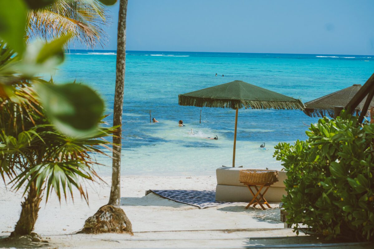 Beachfront view at Tulum Wedding Venue with turquoise water and palm trees