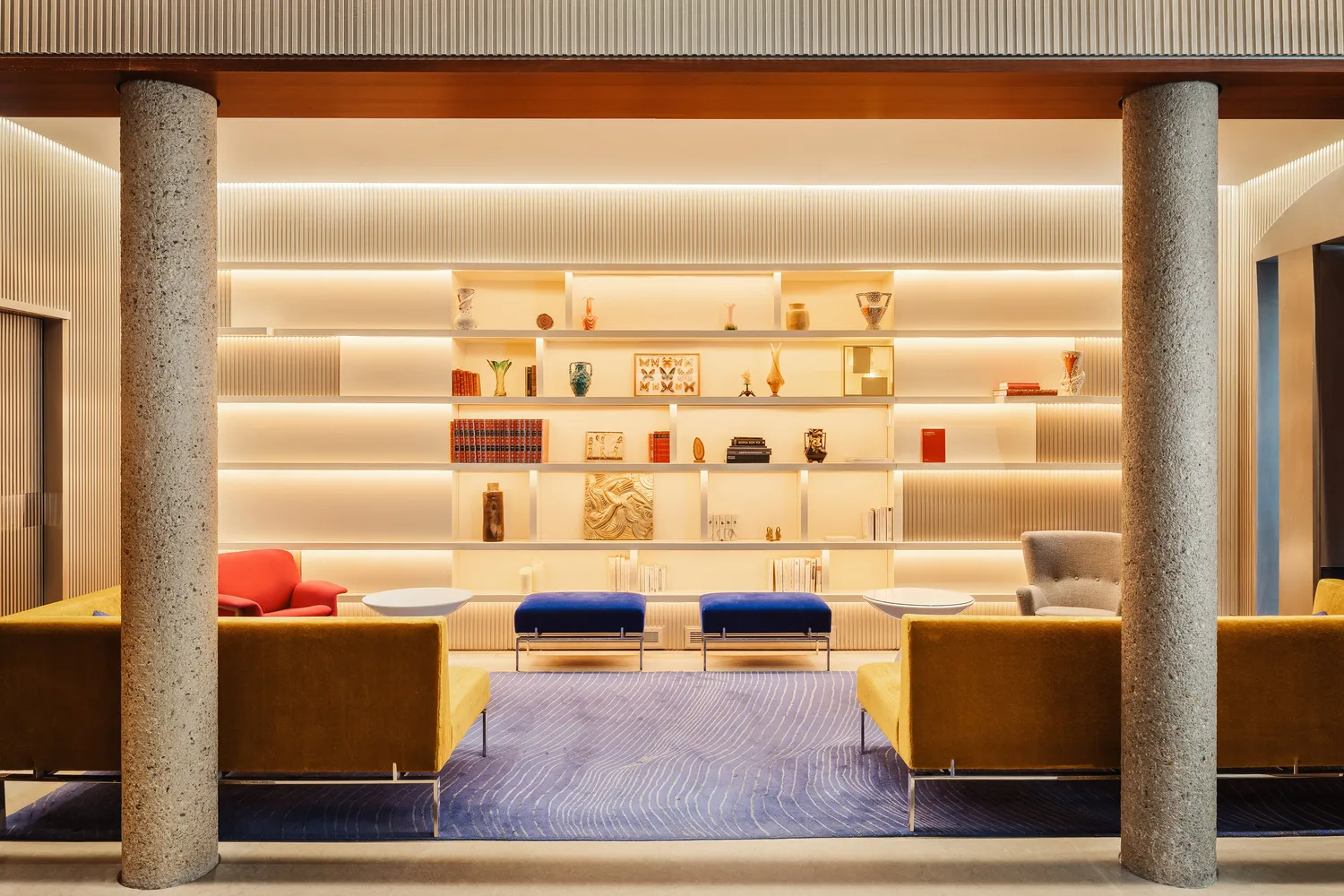 Elegant lobby at Hotel de Sers, a romantic Paris wedding venue. Stylish seating and built-in shelving.