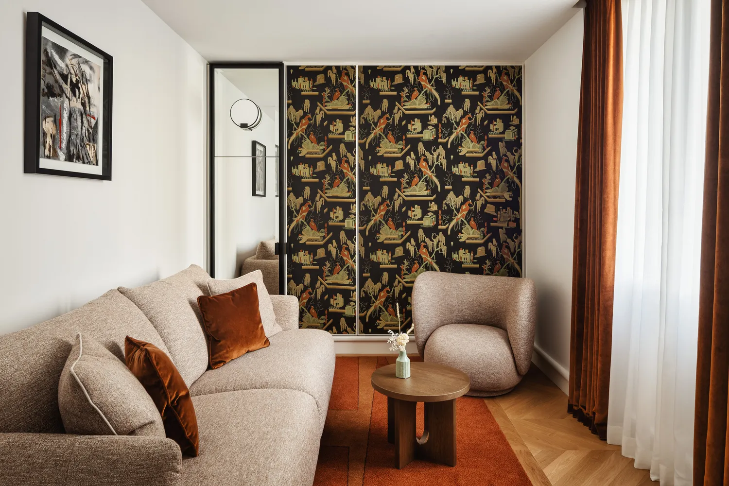 Elegant Parisian hotel suite with beige sofa, armchair, and patterned wardrobe, ideal for a romantic Paris wedding venue.