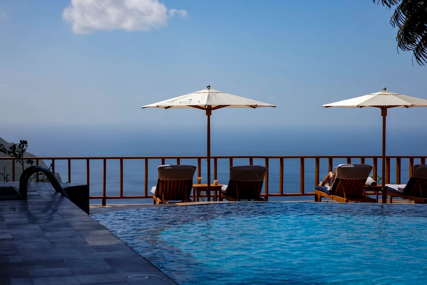Luxury resort infinity pool overlooking ocean; perfect for an island wedding or honeymoon at Ladera Resort.