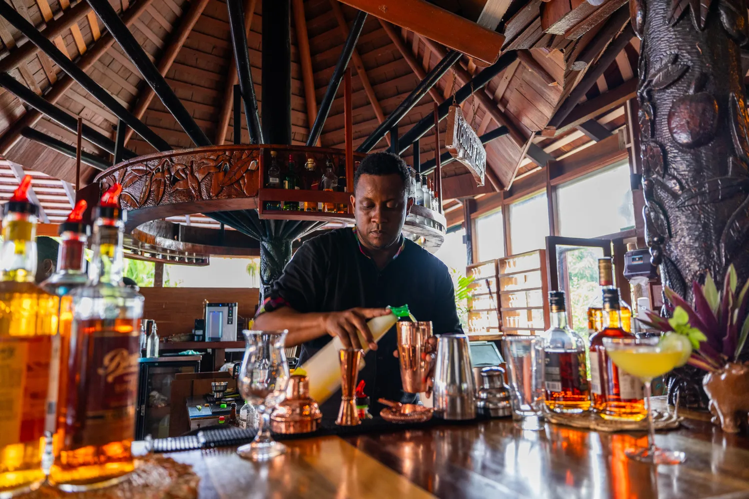 Bartender mixing a cocktail at Ladera Resort bar.