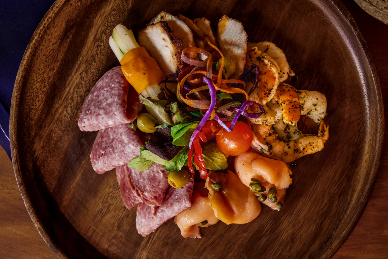 Gourmet appetizer platter with salami, smoked salmon, shrimp, and chicken. Perfect for an Island Wedding & Honeymoon celebration at Ladera Resort.