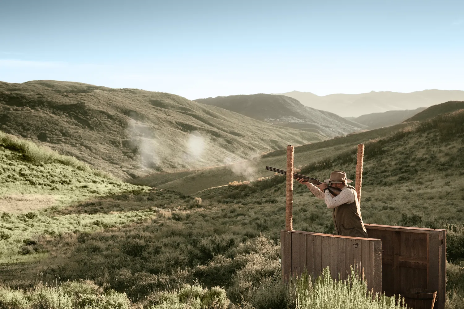 Man clay pigeon shooting at The Lodge at Blue Sky, Auberge Resorts Collection in Utah.
