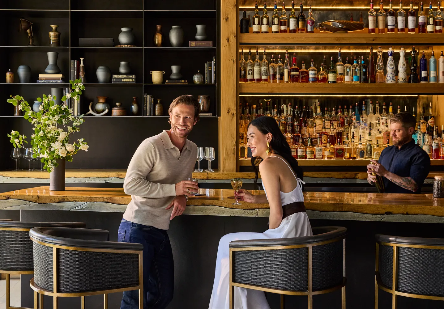 Couple enjoying drinks at The Lodge at Blue Sky bar. Luxury Utah ranch wedding venue.