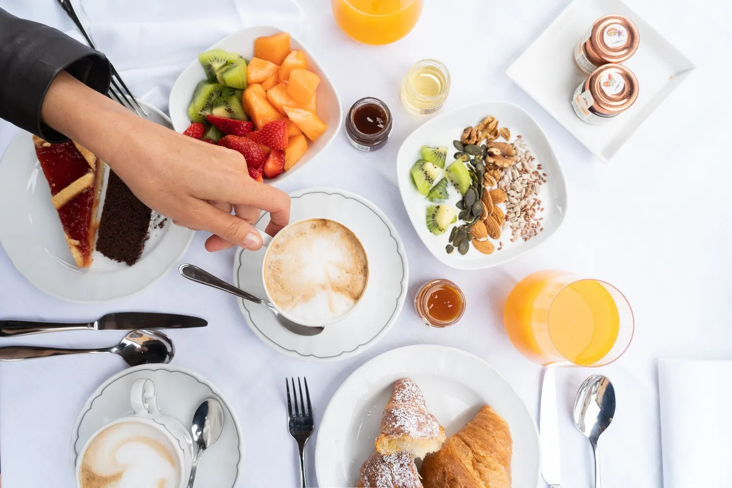 Luxurious Tuscan breakfast spread with pastries, fruit, and coffee. Perfect for a romantic Tuscany honeymoon or wedding.