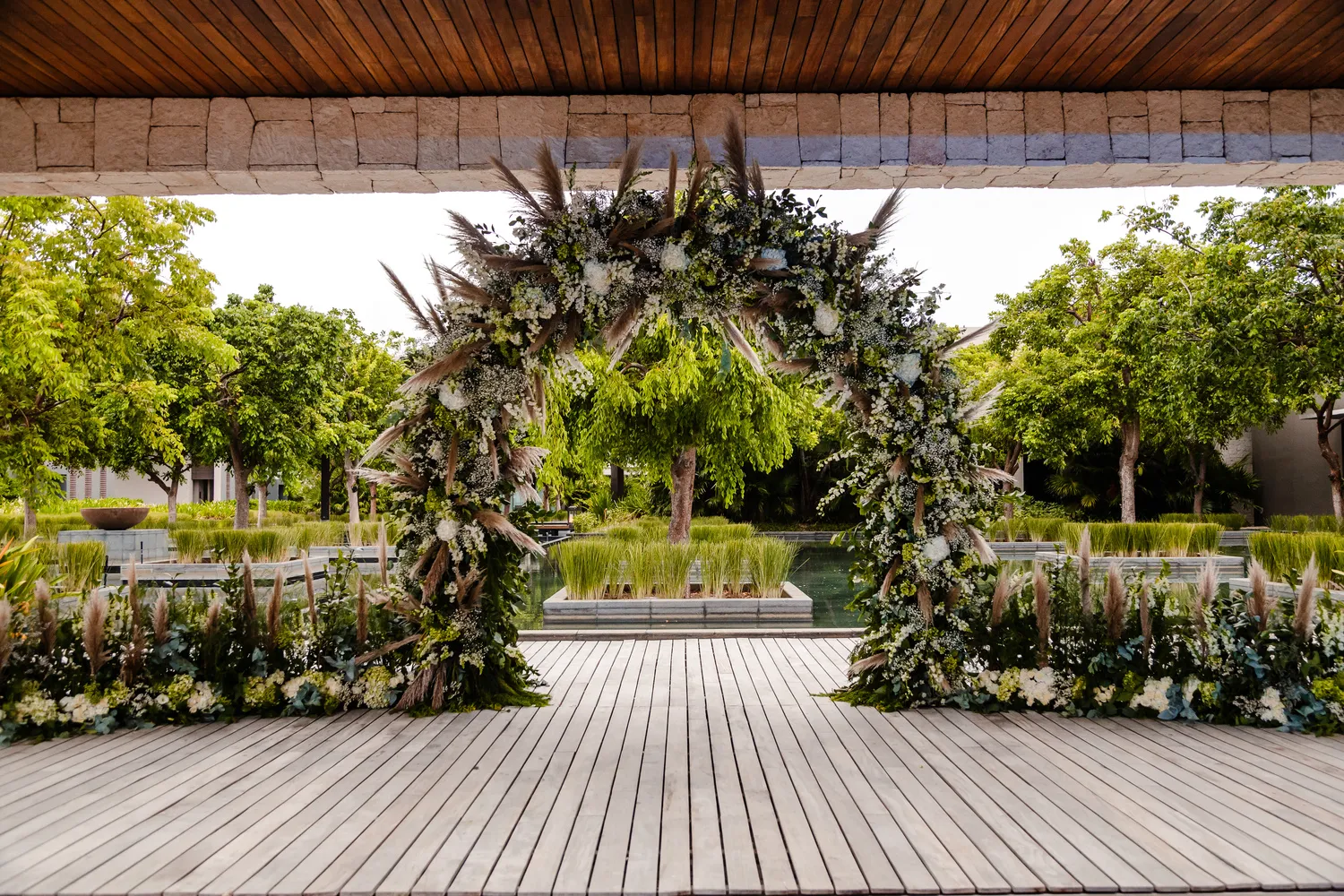 Elegant floral wedding arch at NIZUC Resort & Spa, perfect for a Cancun wedding or honeymoon.