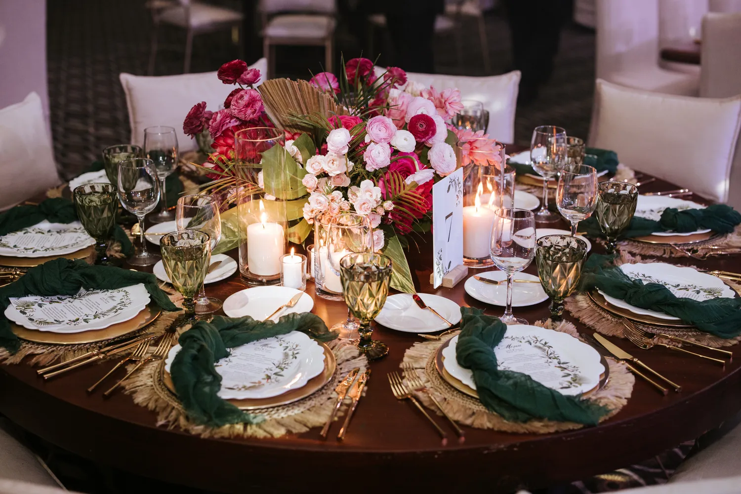 Elegant Cancun wedding reception table setting with floral centerpiece and table number 7. NIZUC Resort & Spa.