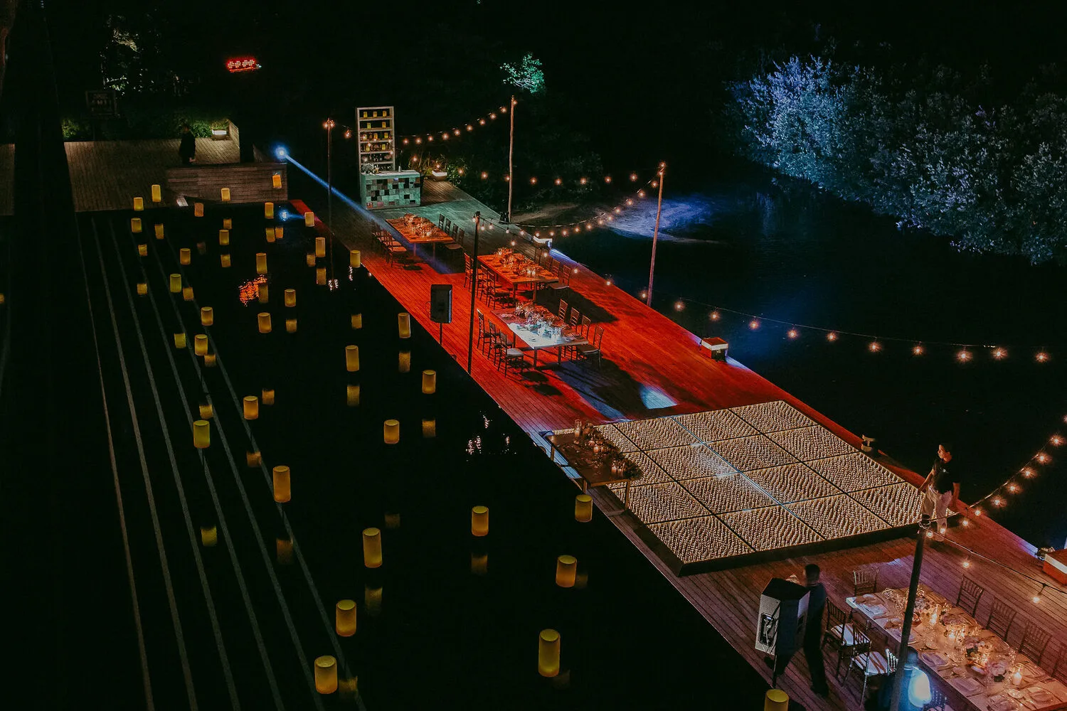 Romantic Cancun wedding reception at NIZUC Resort & Spa, featuring candlelit walkways and a dance floor.
