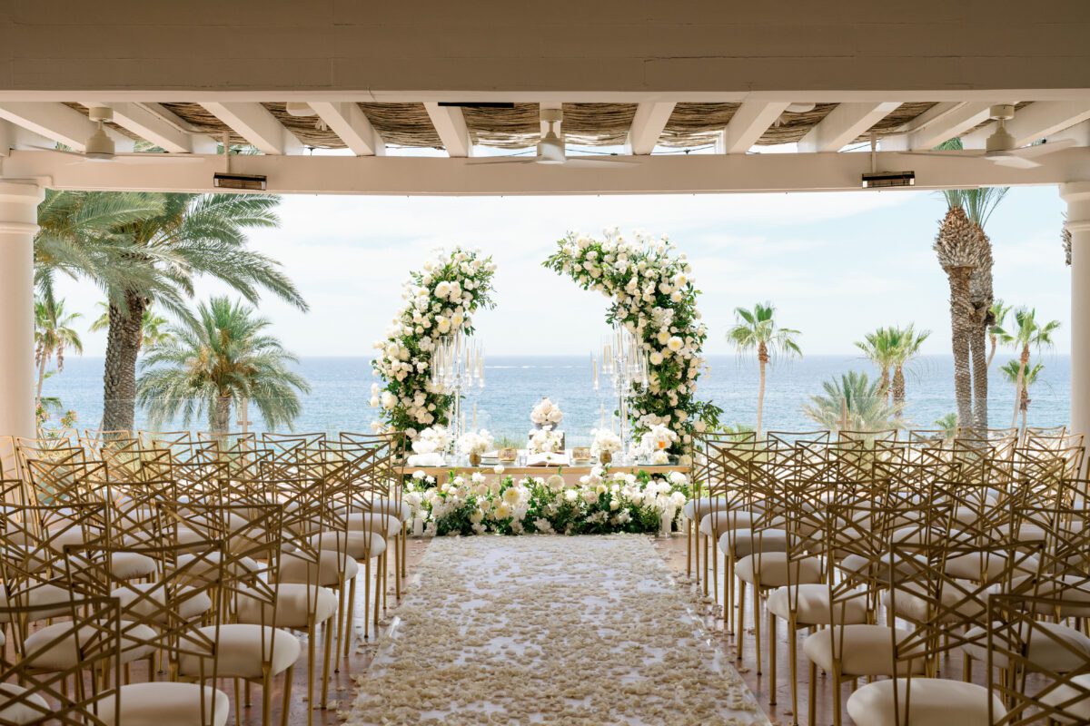 Los Cabos destination wedding setup with floral arch at Hilton Los Cabos.