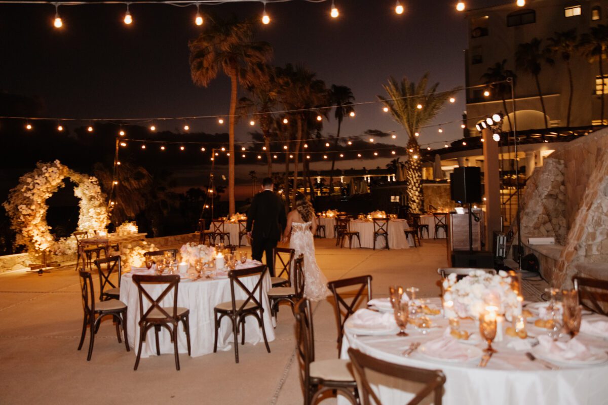Couple walking at their Los Cabos destination wedding reception, Hilton Los Cabos.