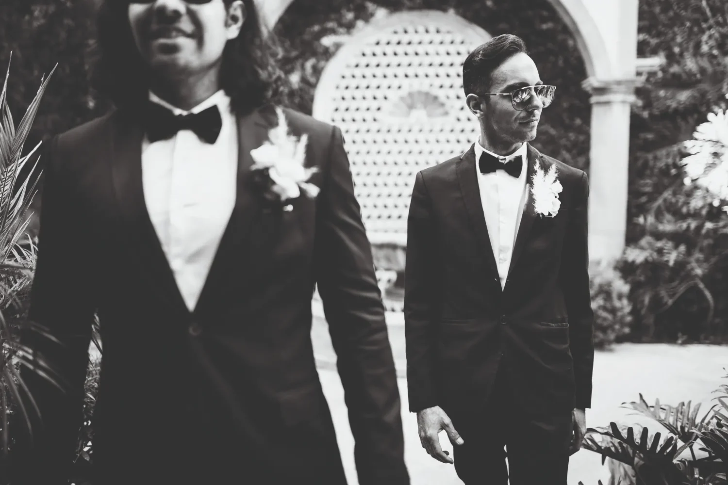 Two grooms in tuxedos at a Casa de Sierra Nevada wedding.