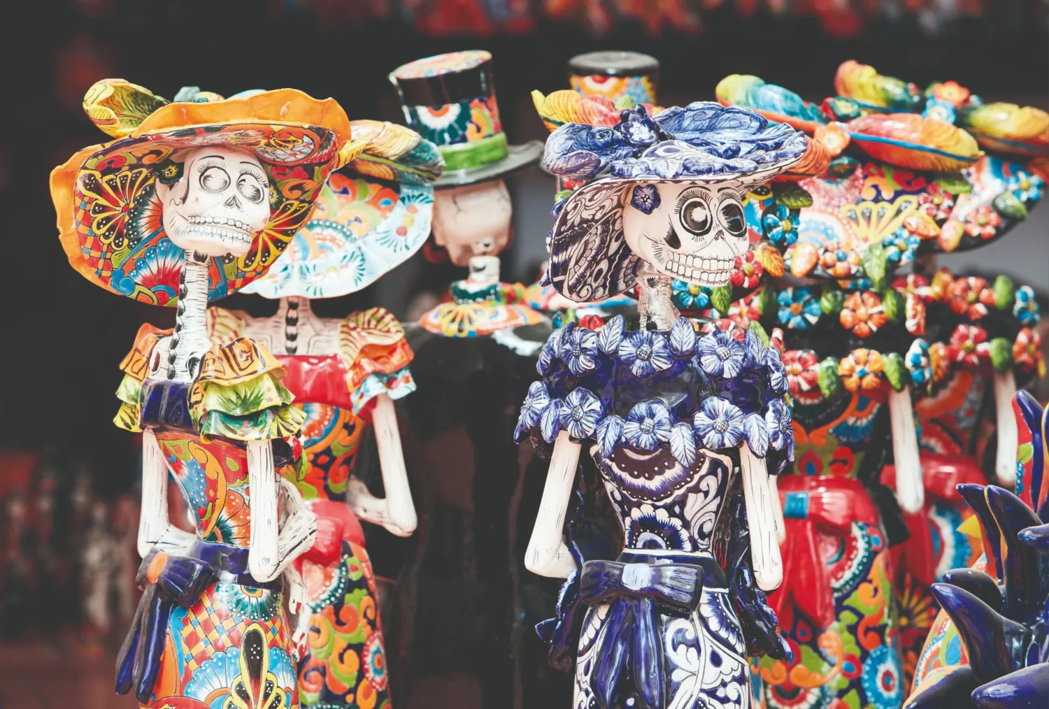 Colorful Calaveras Catrinas, traditional Mexican Day of the Dead figurines.