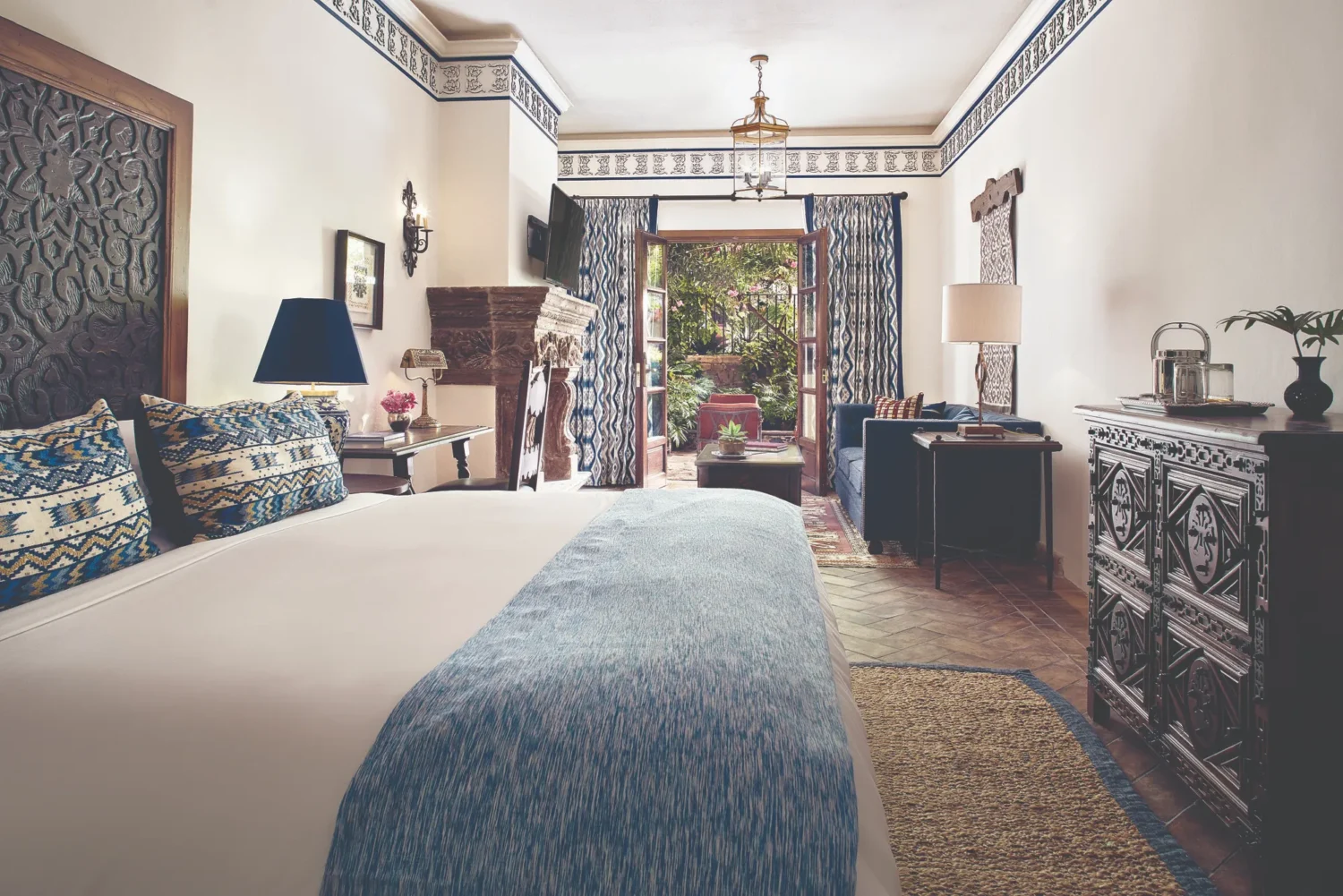 Luxurious Casa de Sierra Nevada hotel room with courtyard view. Features a king bed and sitting area.