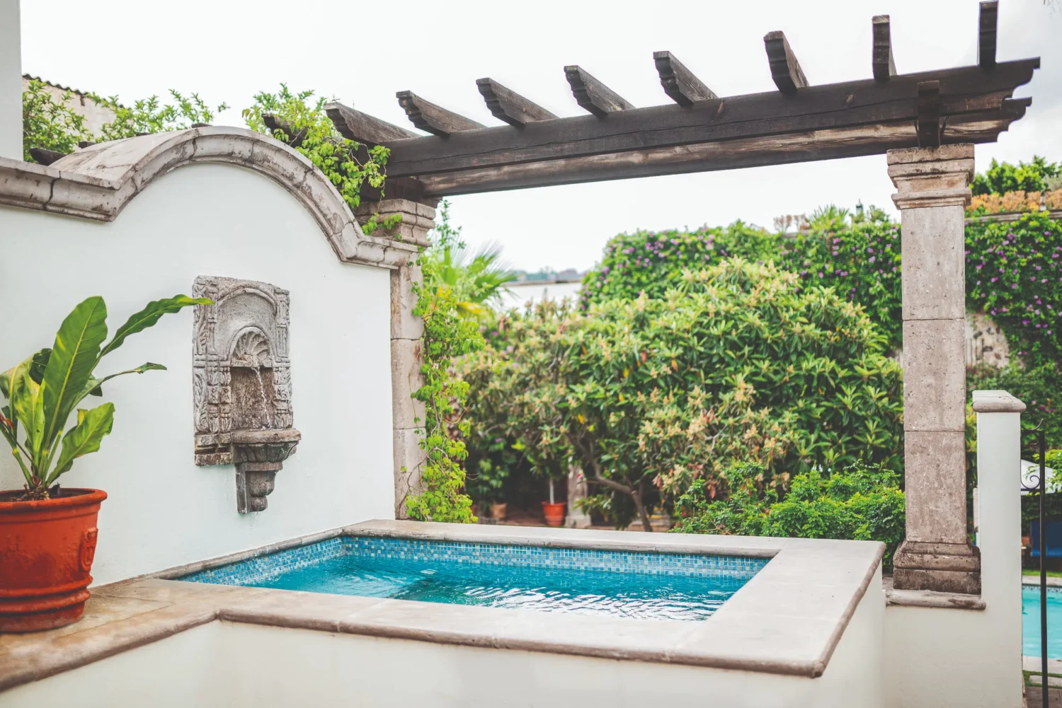 Small plunge pool and stone fountain at Casa de Sierra Nevada in San Miguel de Allende.