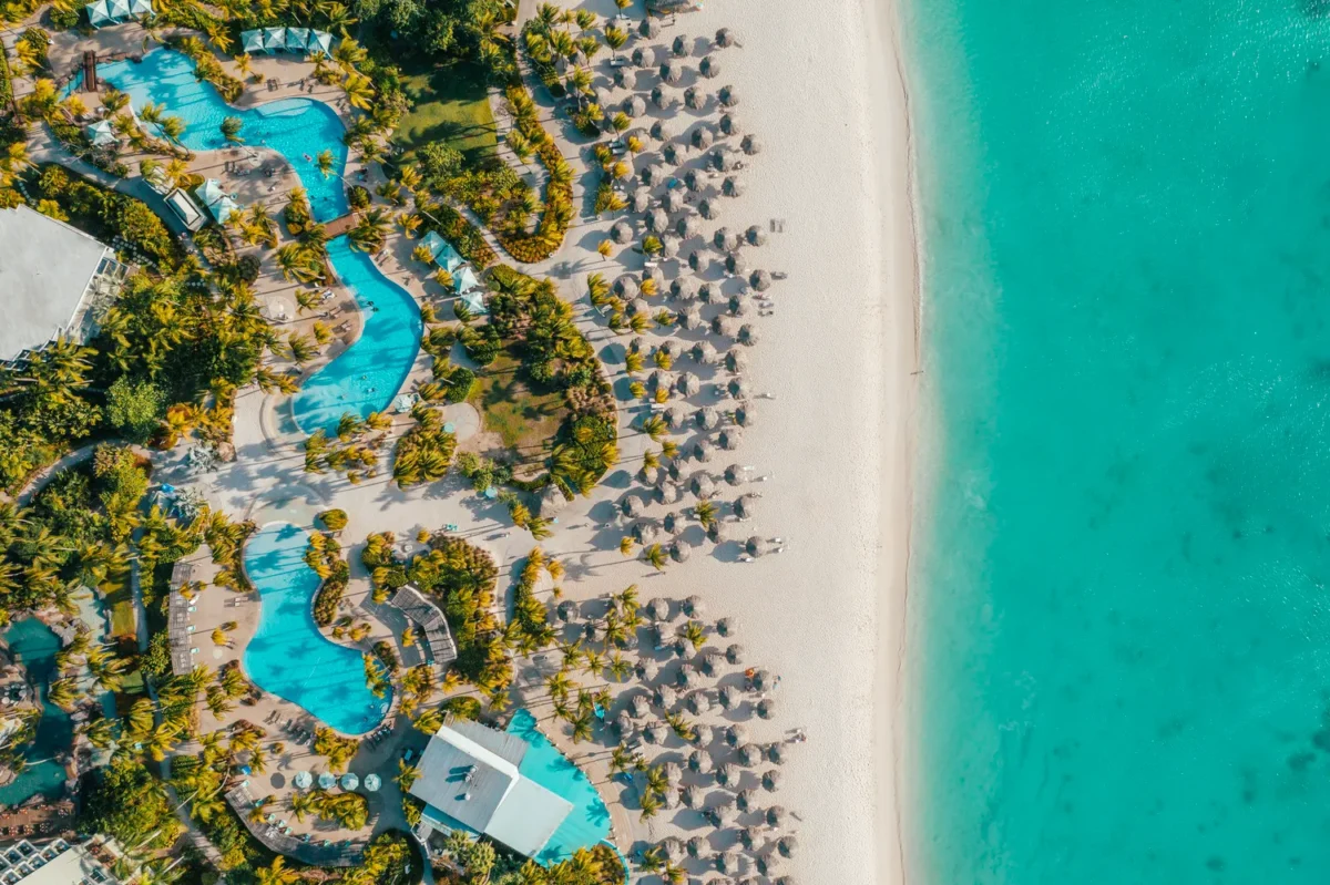 Aerial view of Hilton Aruba Caribbean Resort with turquoise water and a pristine beach, perfect for a Hilton Aruba Destination Wedding.