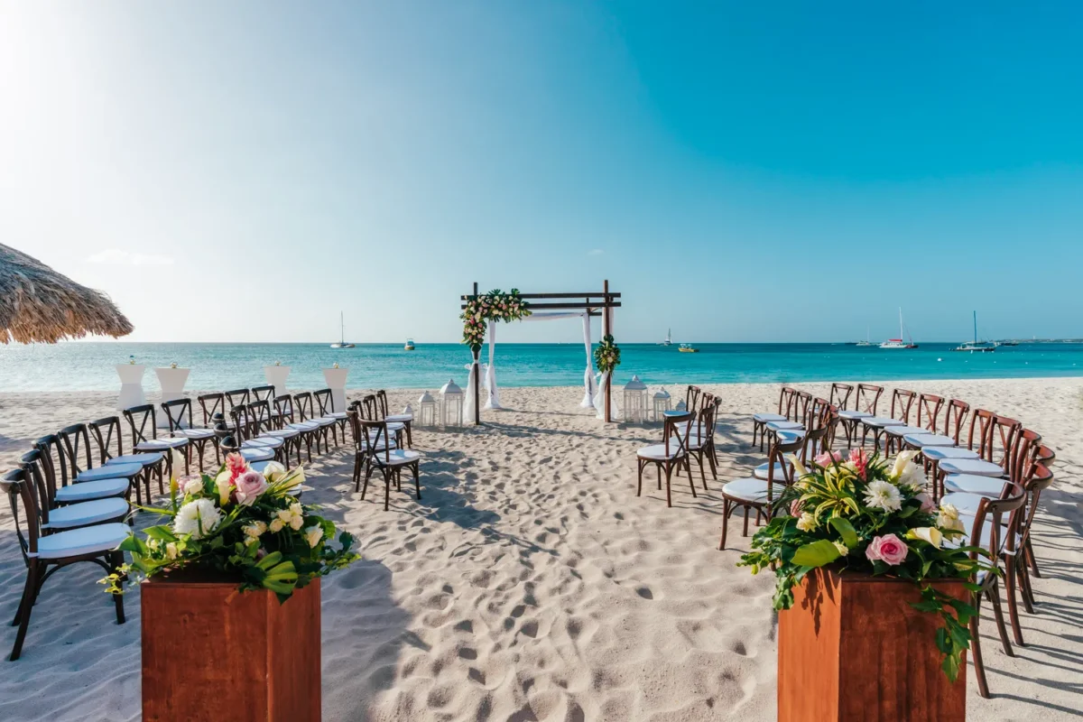 Beach wedding ceremony setup at Hilton Aruba Caribbean Resort, perfect for a Hilton Aruba Destination Wedding.