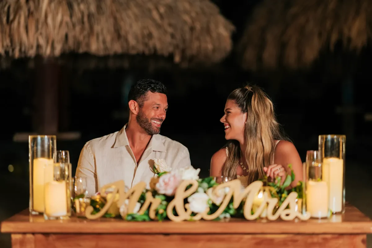 Newlyweds at a Hilton Aruba Destination Wedding, smiling at each other. 