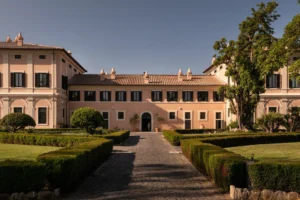Elegant Roman villa, perfect wedding venue. Features manicured gardens and classic architecture.
