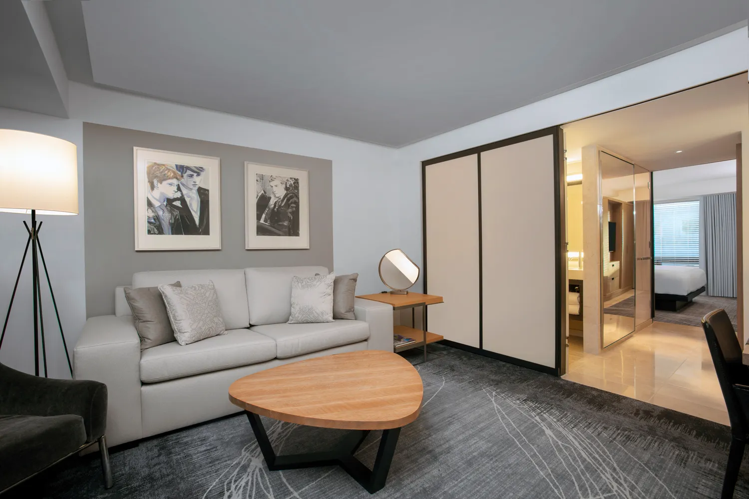 Modern suite at Conrad New York Downtown, featuring a comfortable sitting area perfect for NYC wedding guests.