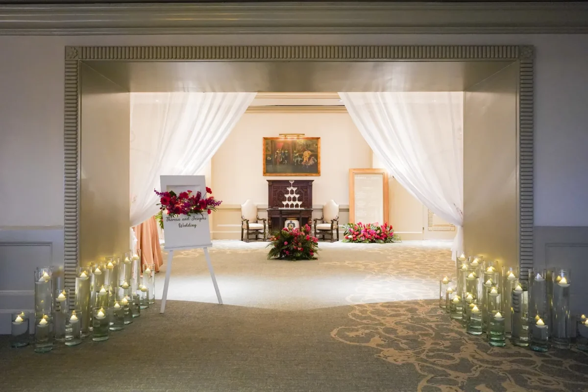 Elegant wedding setup at Kempinski Hotel Cancún, a destination wedding resort, featuring candles and floral arrangements.