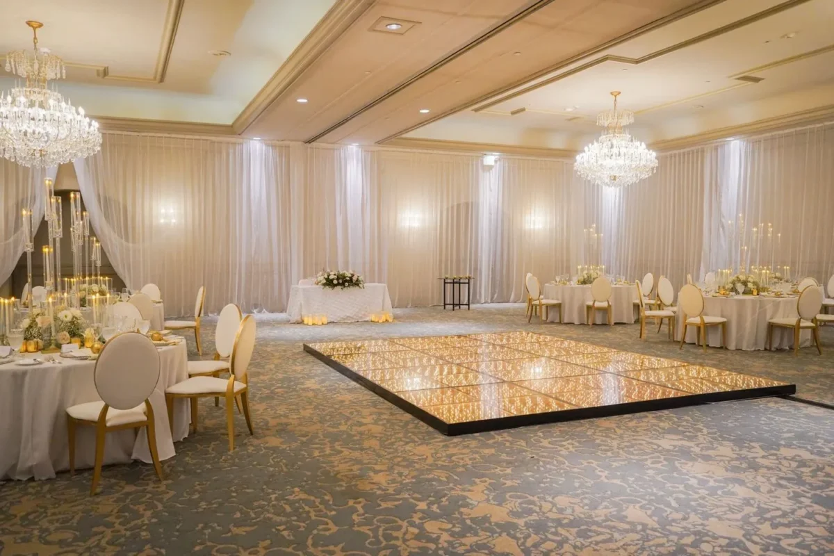 Elegant ballroom setup at a Destination Wedding Resort, Kempinski Hotel Cancún, with mirrored dance floor.