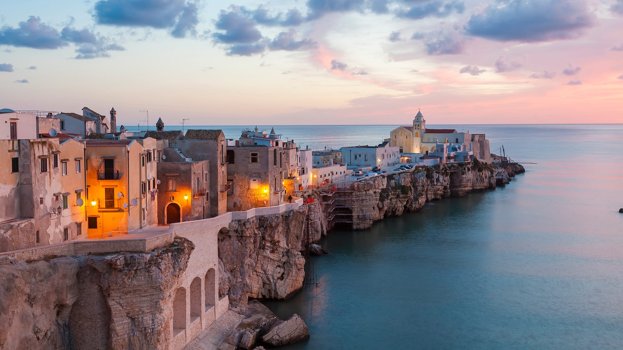 Vieste, Italy, coastal town on cliffs overlooking the Adriatic Sea at sunset