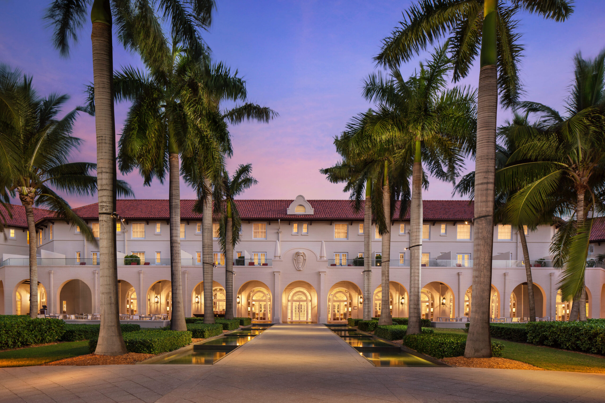 Casa Marina Key West facade with palm trees at sunset, ideal for Florida wedding venues