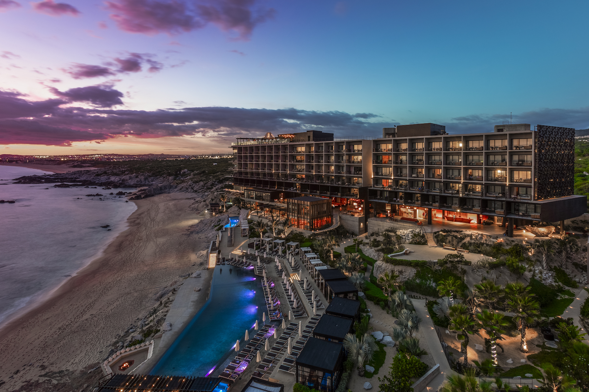 Stunning sunset view of The Cape, a Thompson Resort in Los Cabos, ideal for weddings.