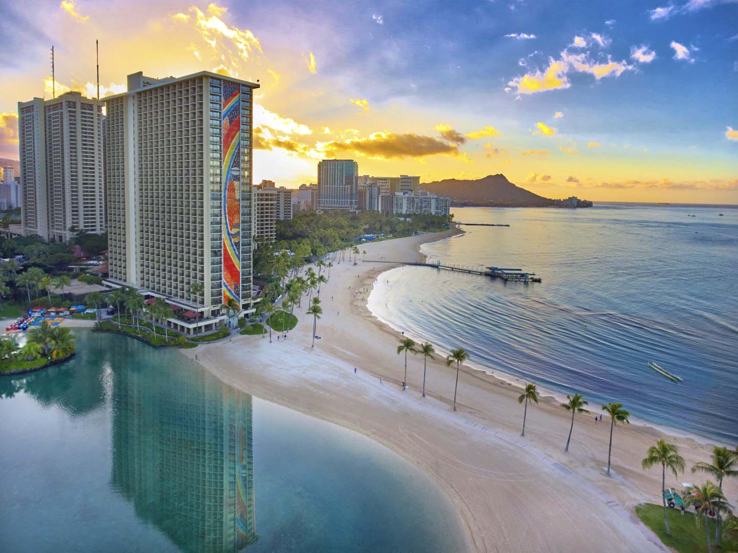 Sunset view of Hilton Hawaiian Village Waikiki Beach Resort coastline