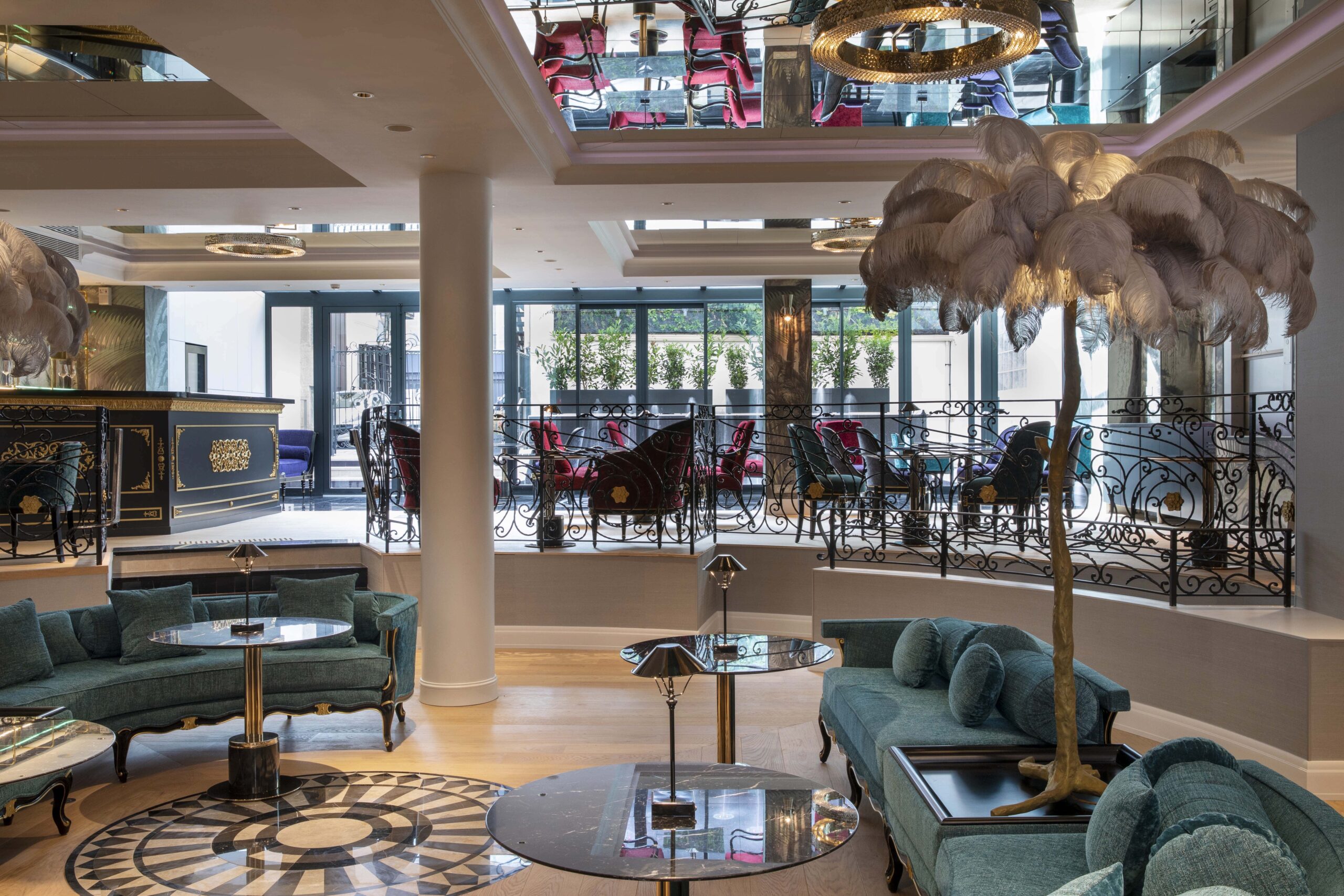 Elegant lobby of Paris j'Adore Hotel & Spa with plush seating and unique decor