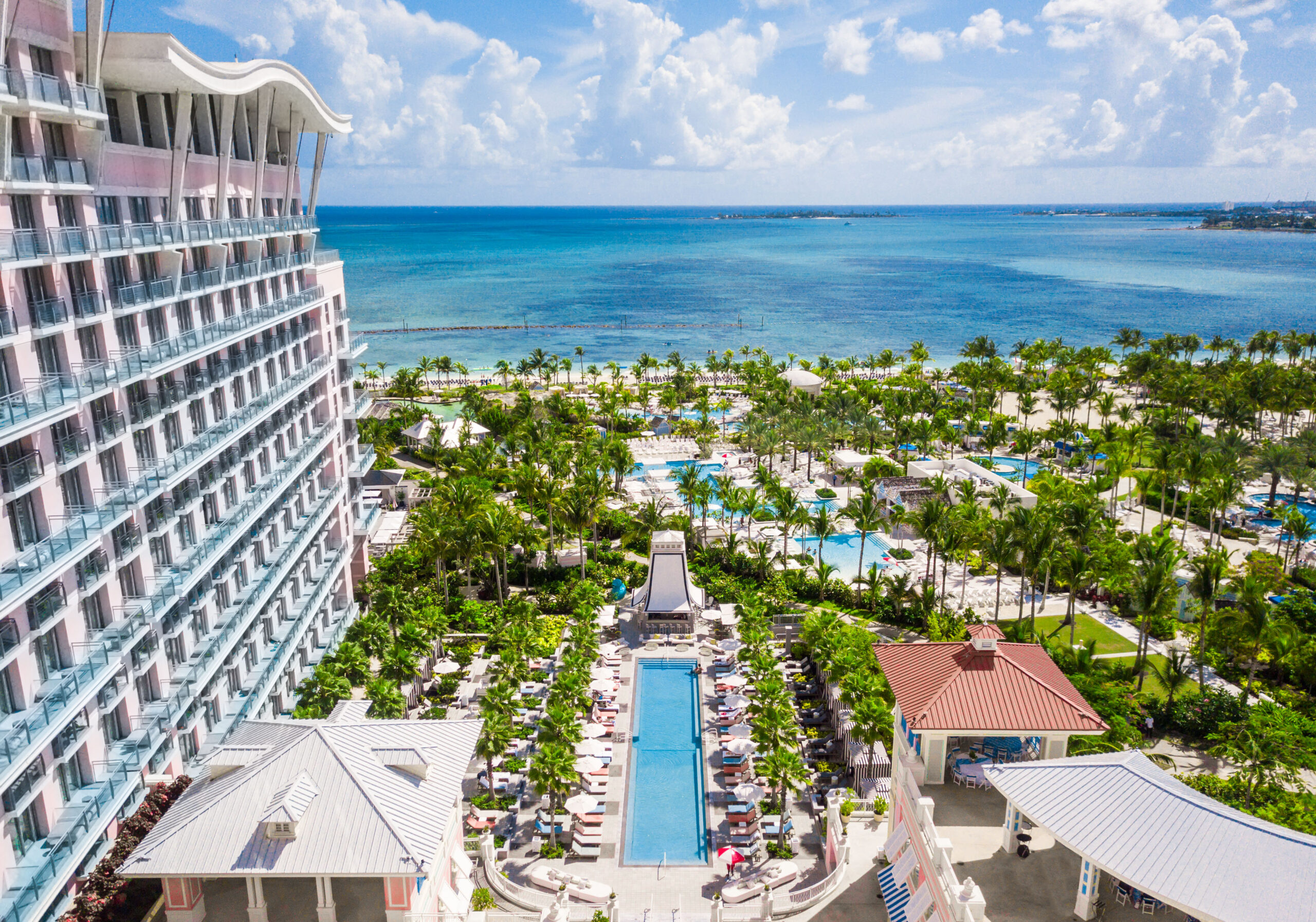 Resort pool and gardens overlooking the ocean at Nassau Wedding Destination