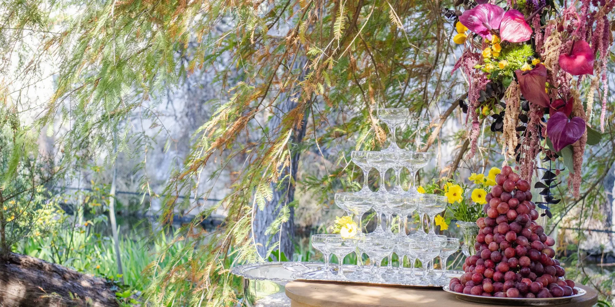 Champagne pyramid and grape display at a dream Mexico wedding. Agua Bendita.
