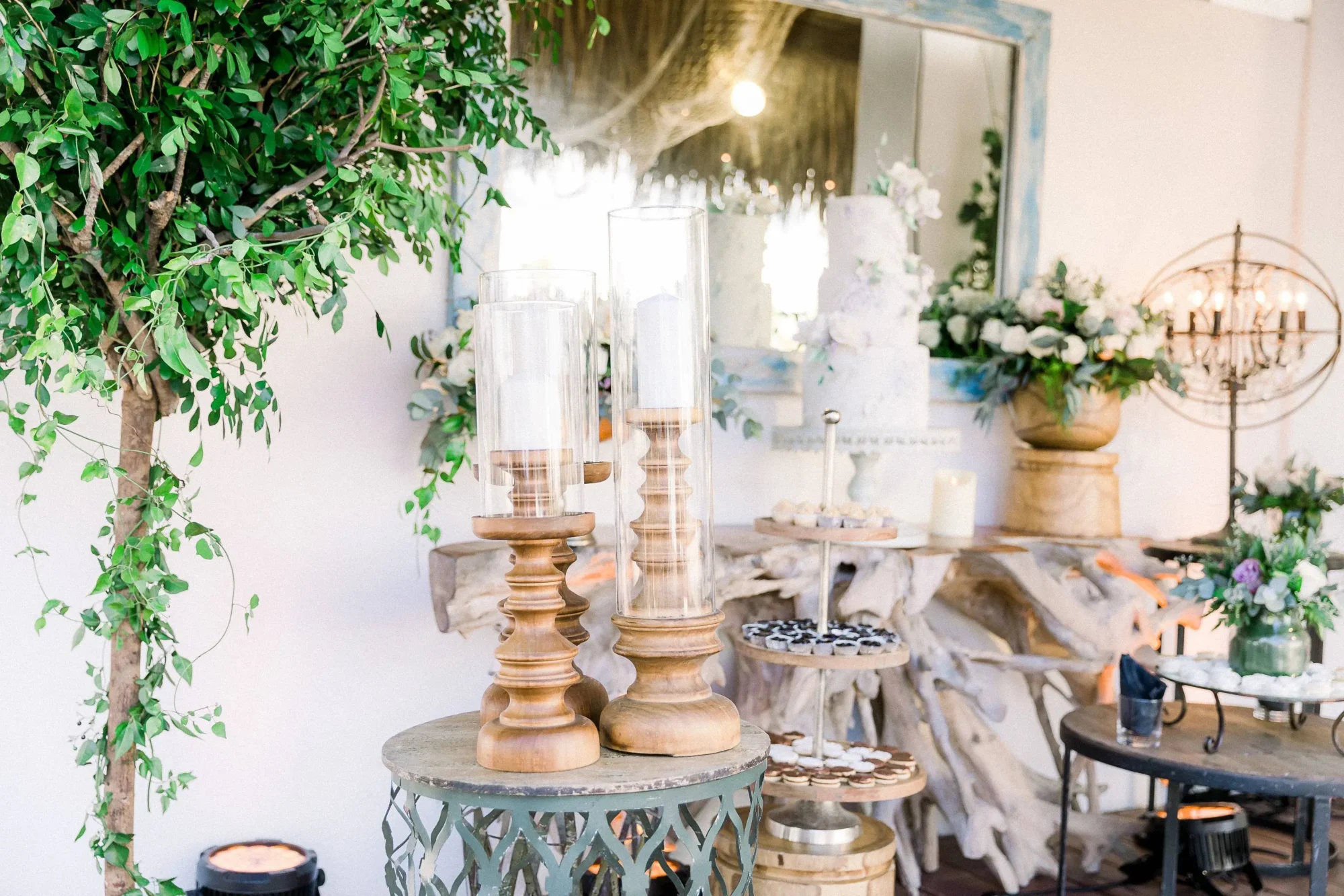 Elegant candle centerpieces and dessert display at a Dominican Republic wedding.