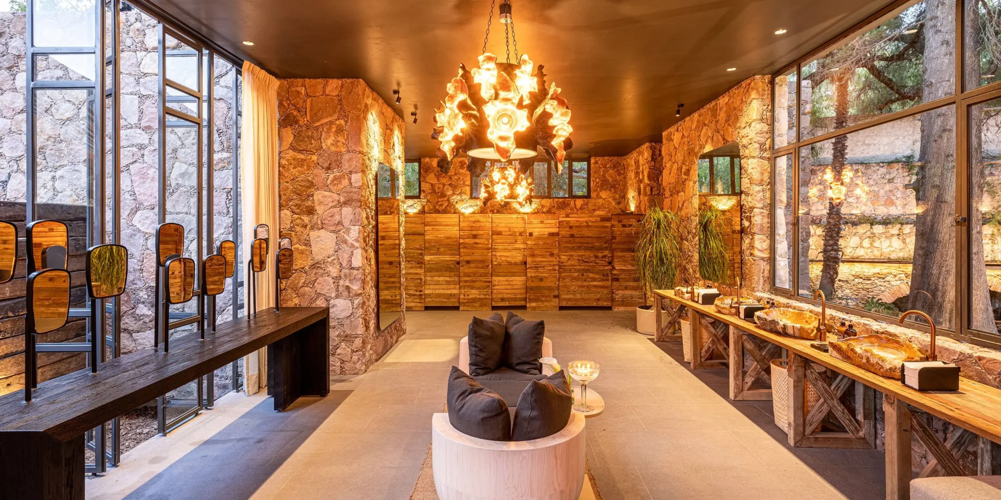 Luxurious spa bathroom at Agua Bendita, featuring stone walls, wooden accents, and unique sinks. Perfect for a dream wedding in Mexico.