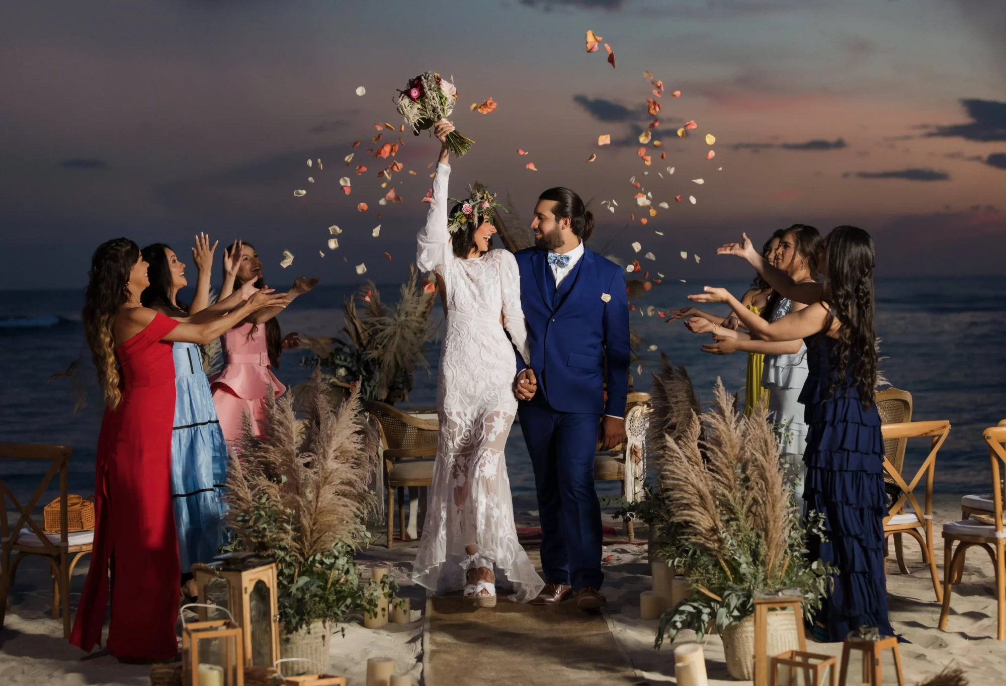 Bride and groom holding hands, walking down the aisle at their Dominican Republic beach wedding.
