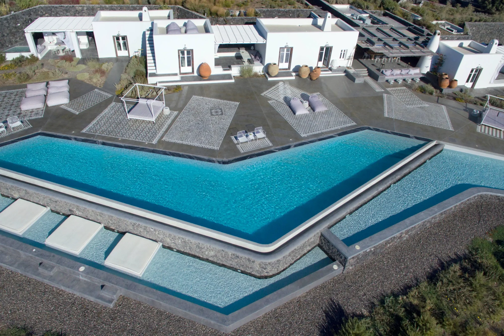 Luxury Santorini villa with infinity pool; dream wedding location.