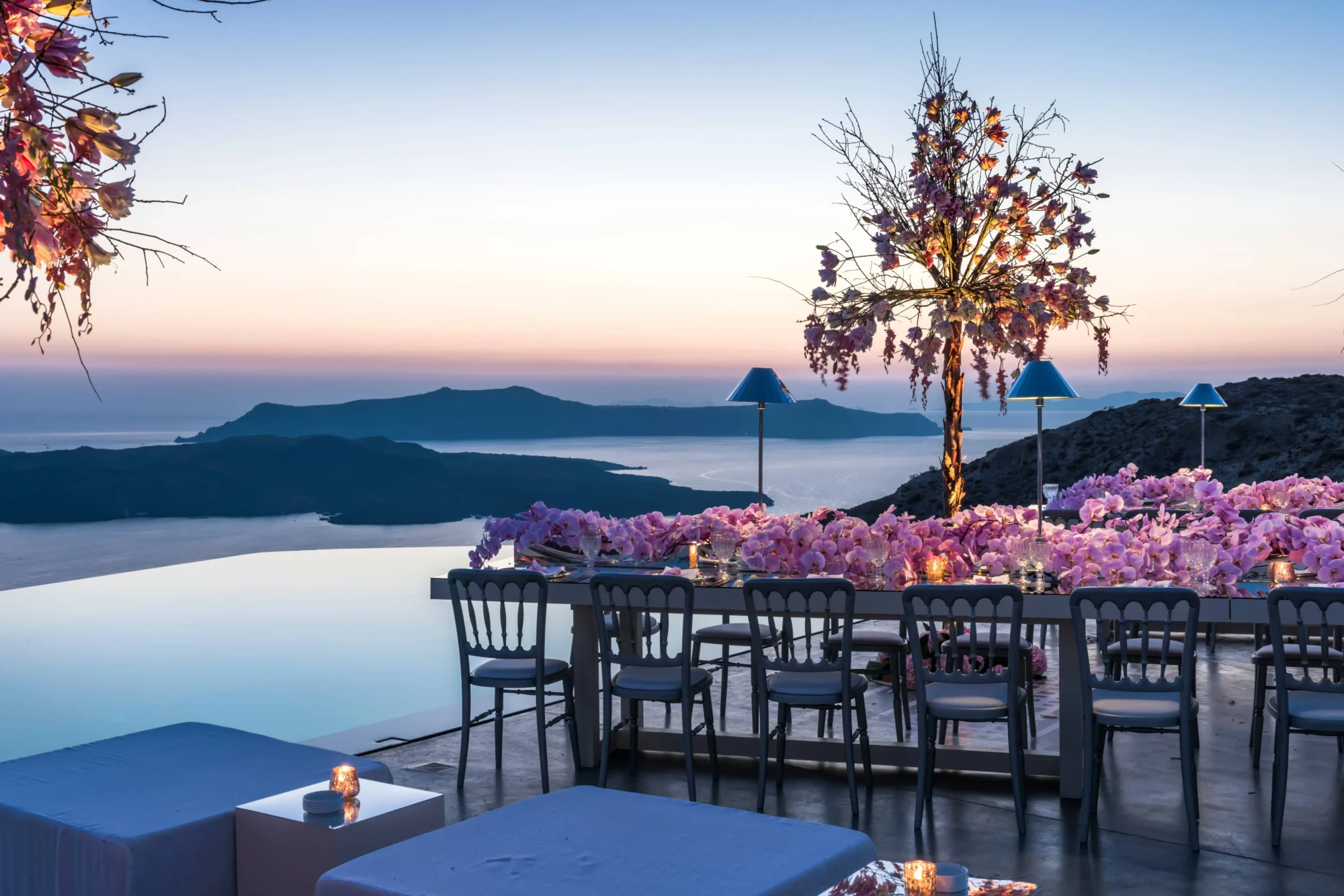 Romantic Santorini wedding reception overlooking the Aegean Sea. Dream wedding in Santorini.