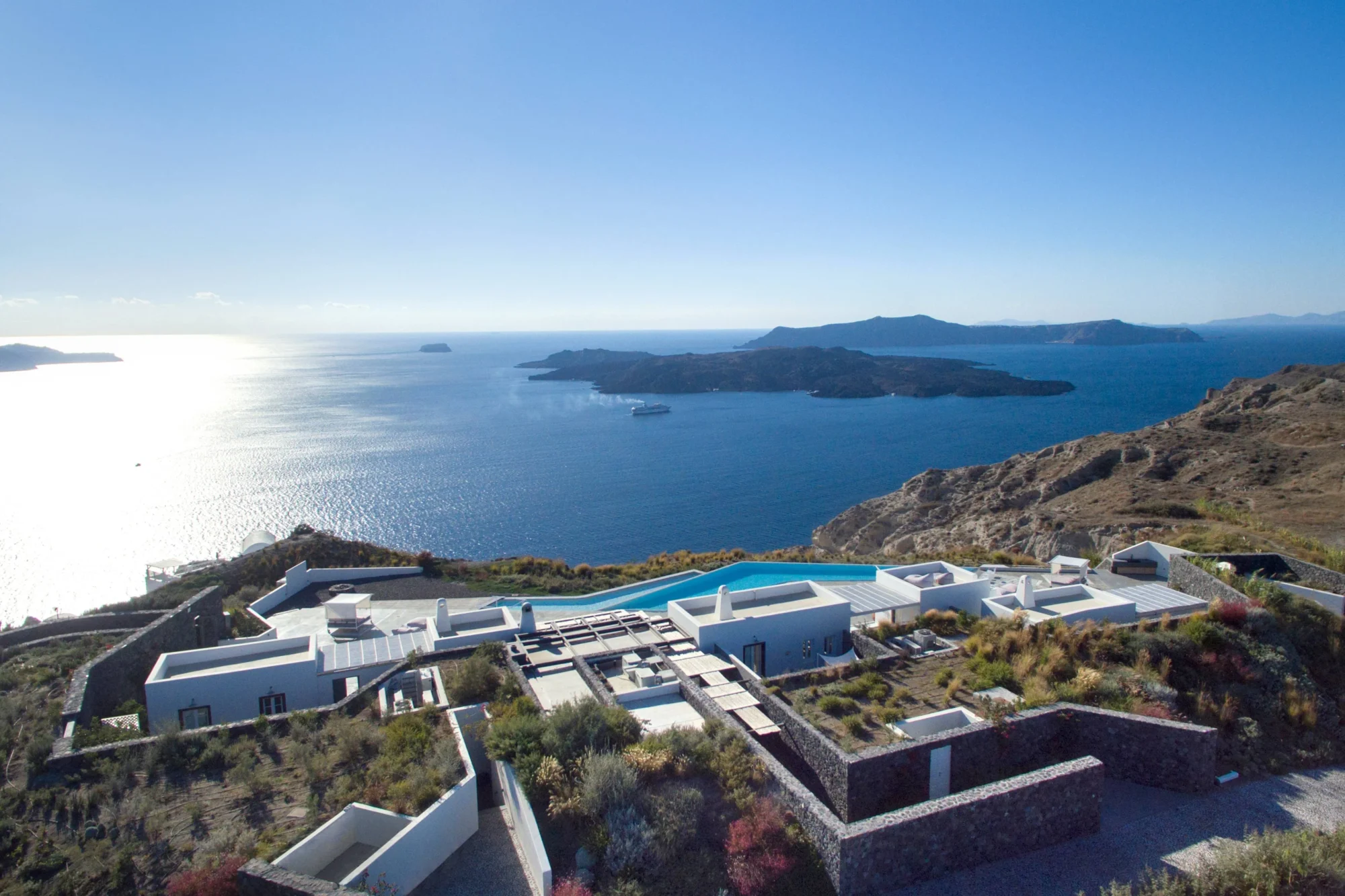 Luxury Santorini villa with infinity pool overlooking the Aegean Sea. Dream wedding location.