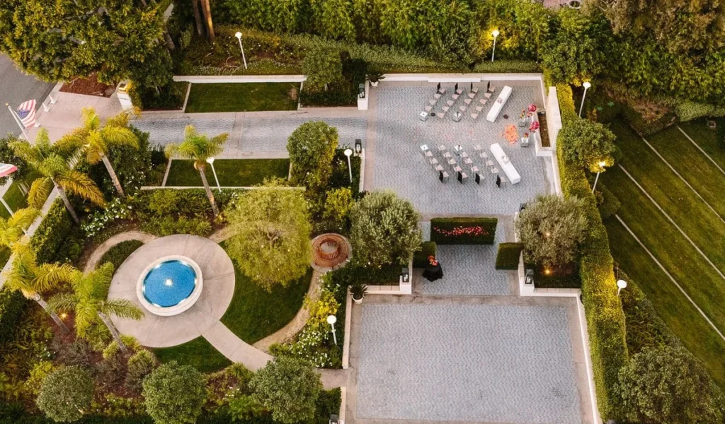 Aerial view of a Los Angeles wedding ceremony setup at Cameo Beverly Hills, featuring a courtyard with seating and landscaping.