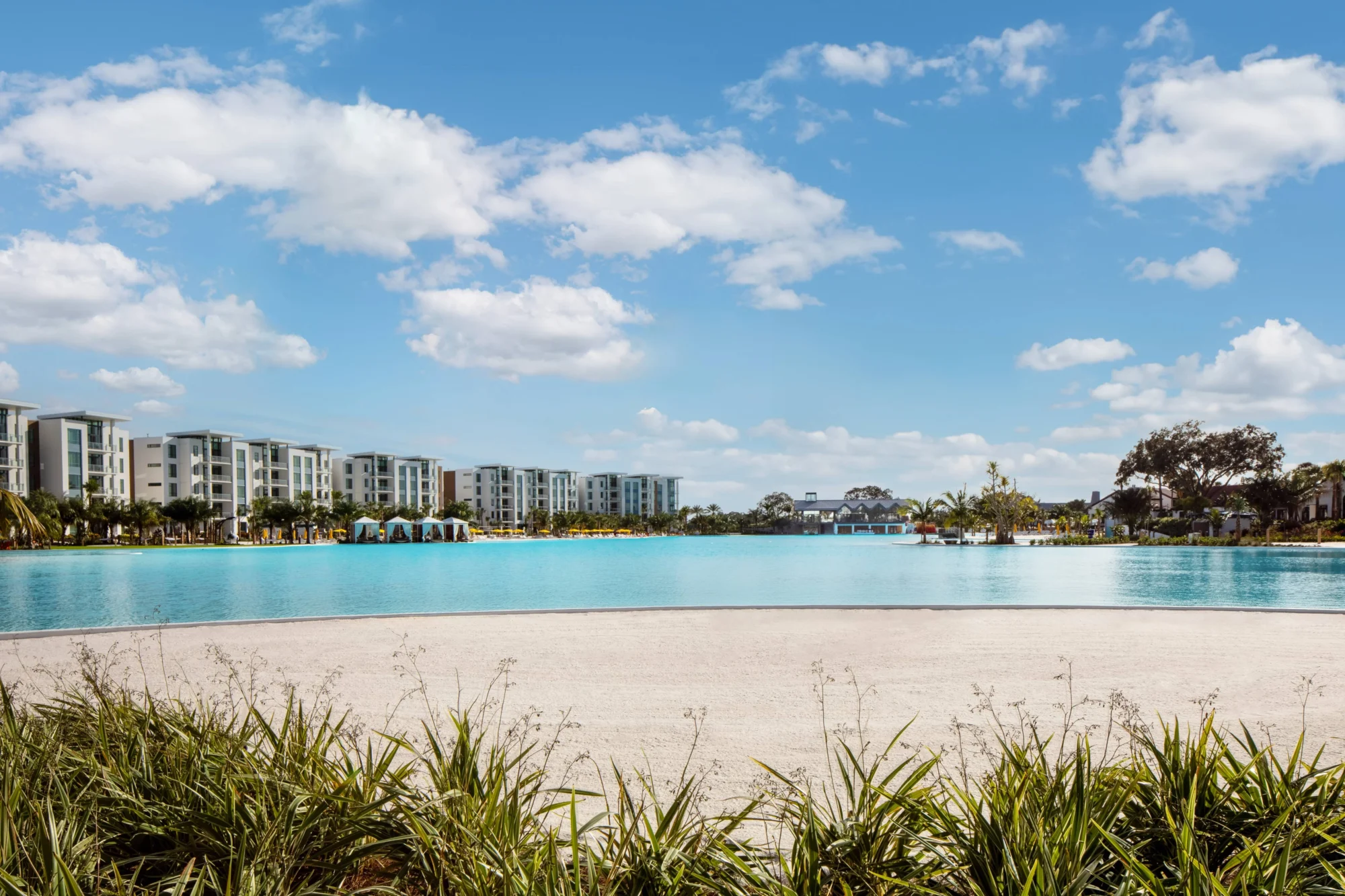 Luxury resort lagoon with white sand beach; ideal Orlando wedding destination.